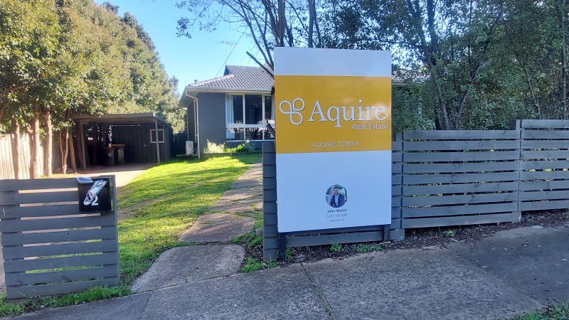 Aquire Real Estate signage
