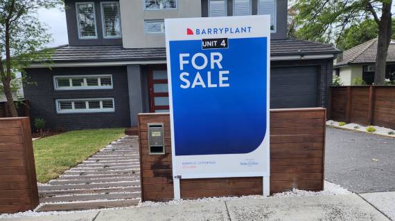A ‘For Sale’ signboard by BarryPlant placed in front of the property.