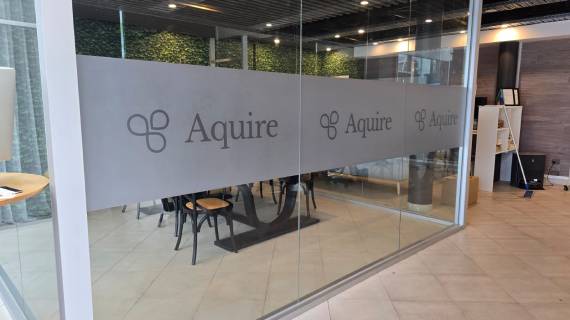 Window signage displayed on the company’s glass display.